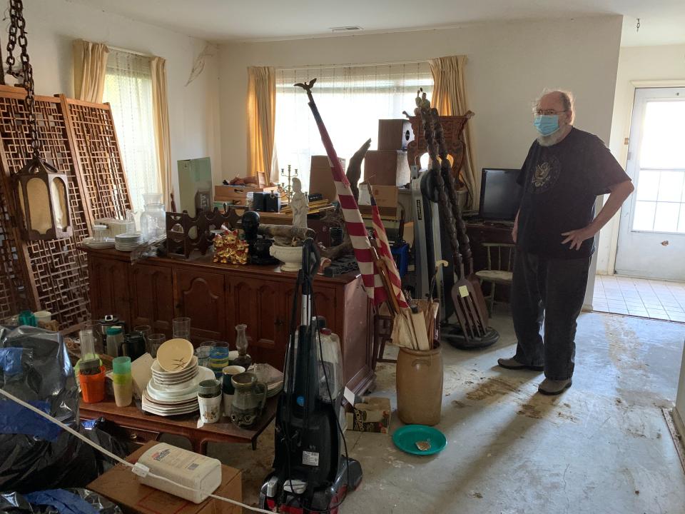 Brooks Conner surveys the items piled up in the living room of his Pinelands townhome after returning home from a two-month hospital and rehab stay for a heart ailment.