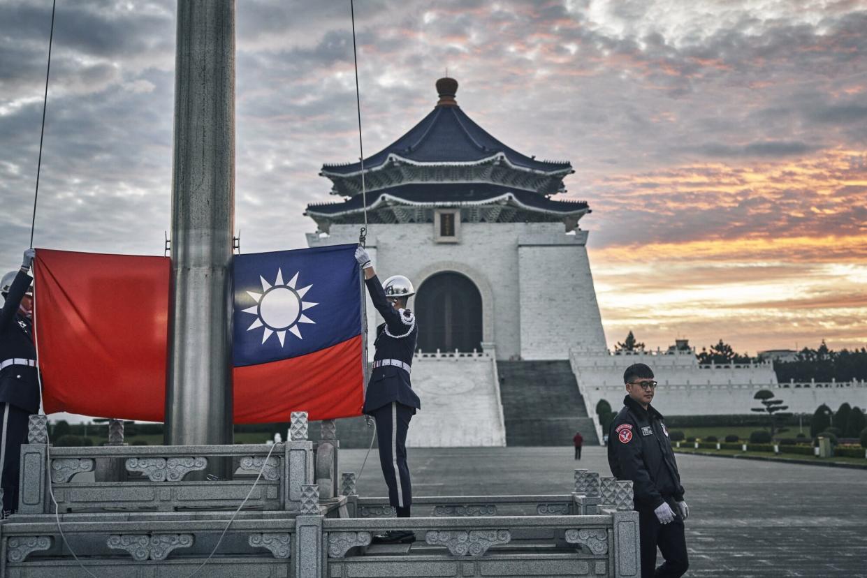 FILE PHOTO: An honour guard during a flag raising ceremony at Chiang Kai Shek Memorial Hall in Taipei, Taiwan, on Wednesday, Dec. 27, 2023. (Photo: An Rong Xu/Bloomberg)