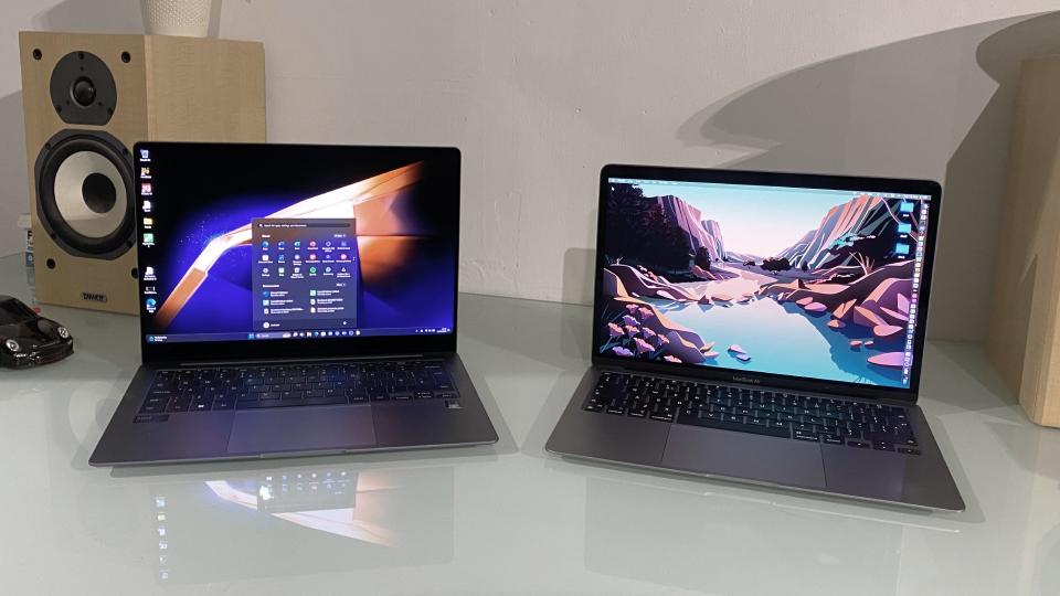 Samsung Galaxy Book4 Pro next to a MacBook Air