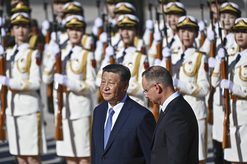 Chinese President Xi Jinping, left and Poland's President Andrzej Duda review the honour guard during the welcome ceremony at the Great Hall of the People in Beijing, Monday, June 24, 2024.(Pedro Pardo/Pool Photo via AP)