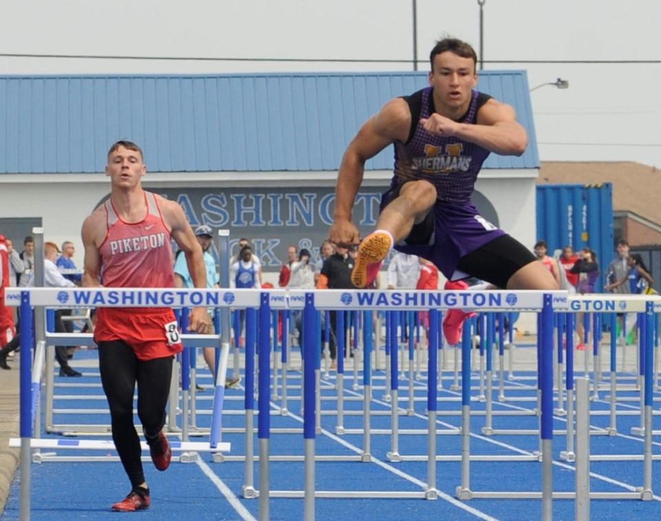 Unioto's Maddox Fox (right) leaps over the final hurdle during the boys 110 meter hurdles in the Division II district track and field meet at Washington High School on May 20, 2023.