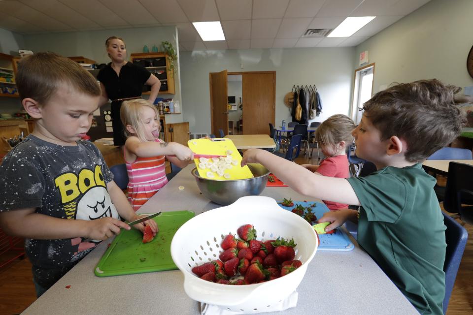 Director Shelby Steffens leads students in making fruit salad as part of a practical life lesson session at Fox Valley Montessori Academy Monday, May 22, 2023, in Appleton, Wis.