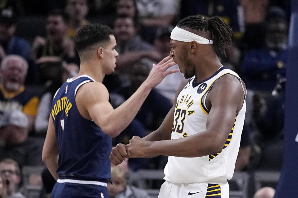 Indiana Pacers' Myles Turner (33) reacts after hitting a shot and getting fouled during the first half of an NBA basketball game against the Denver Nuggets, Wednesday, Nov. 9, 2022, in Indianapolis. (AP Photo/Darron Cummings)