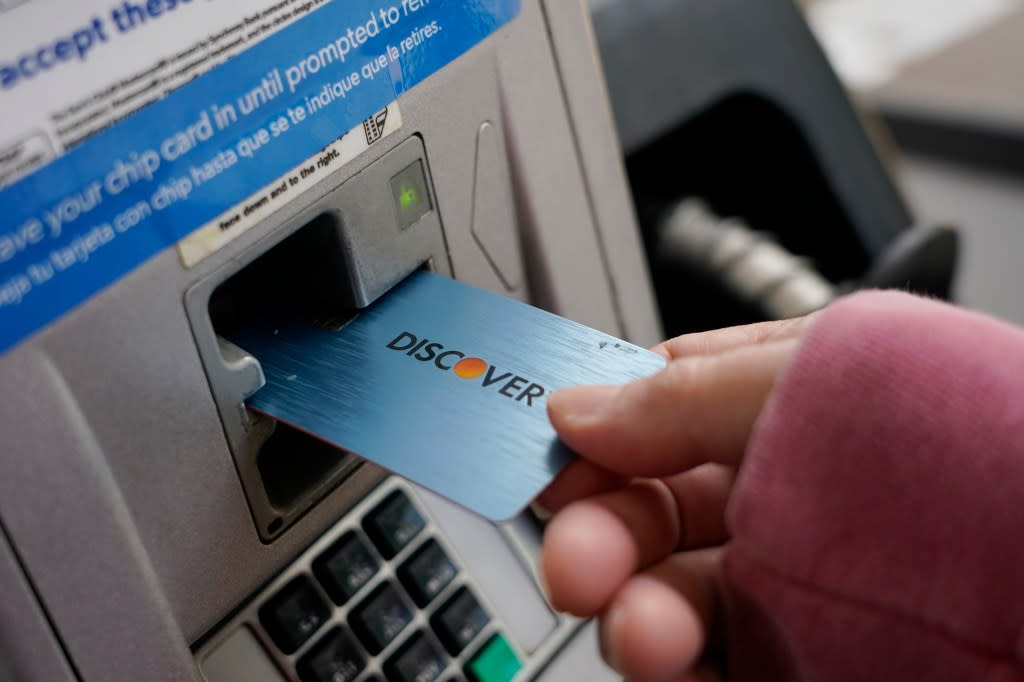 A Discover card is used to pay for gasoline at a Sam’s Club in Madison, Miss., on July 1, 2021.(AP Photo/Rogelio V. Solis, File)