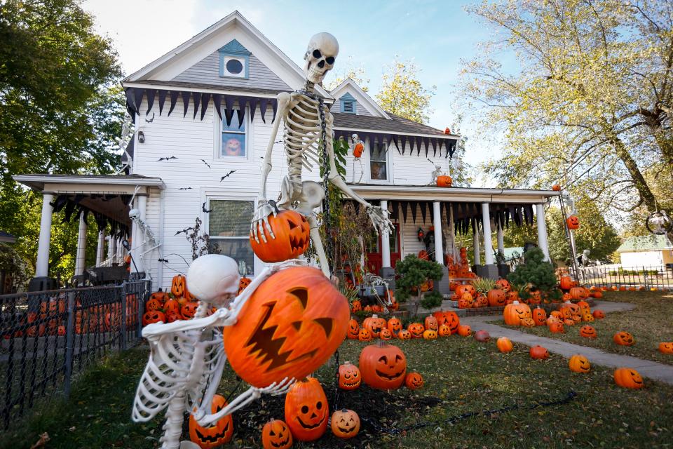 Between 800-900 pumpkins and several hundred skeletons line the lawn and home at 401 S. Main St. in Nixa on Friday, Oct. 14, 2022. The home, known as the Nixa Pumpkin Haunt, is a Halloween tradition in Nixa.