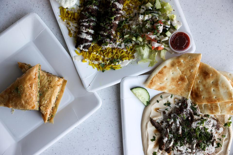A spread of baklava, beef kafta and lamb shawarma and hummus from Syrian Kitchen at Fork Forty Food Hall in Salem, Ore. on Wednesday, Nov. 17, 2021.