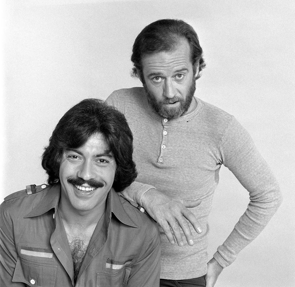 George Carlin standing next to Tony Orlando with his hand on Orlandos shoulder