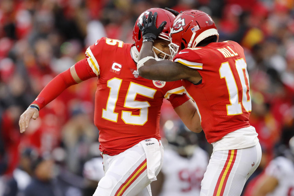 Kansas City Chiefs quarterback Patrick Mahomes (15) celebrates with wide receiver Tyreek Hill (10) during the first half of an NFL divisional playoff football game against the Houston Texans, in Kansas City, Mo., Sunday, Jan. 12, 2020. (AP Photo/Jeff Roberson)