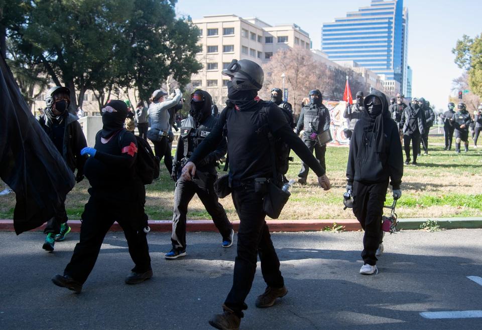 A group of Antifa protesters march toward the California State Capitol in downtown Sacramento.