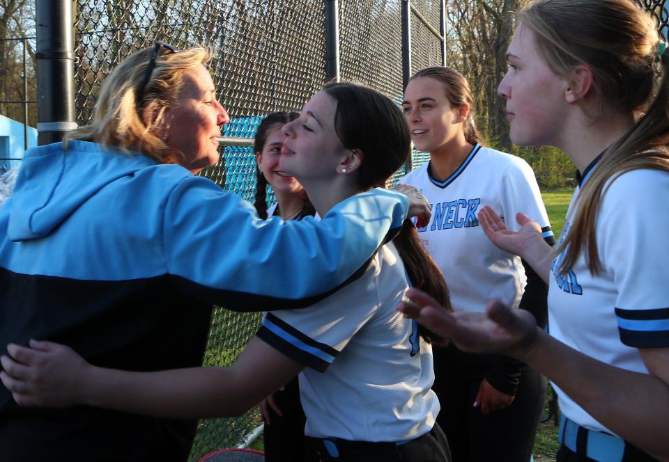Rye Neck softball coach Joan Spedafino is congratulated by her team after defeating Westlake for her 600th career win at Rye Neck High School April 26, 2024.
