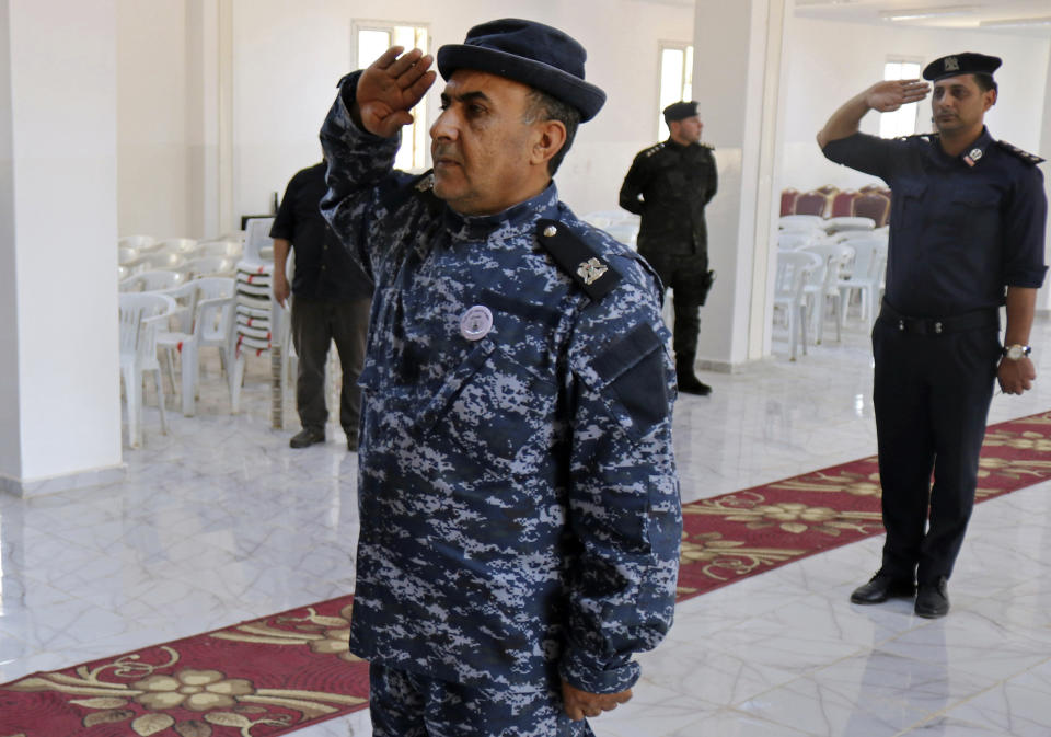 In this Thursday, May 2, 2019 photo, police attend their graduation ceremony in Benghazi, Libya. After years of assassinations, bombings and militia firefights, Libya’s eastern city of Benghazi finally feels safe again -- but security has come at a staggering cost. Forces loyal to Khalifa Hifter, who now controls eastern Libya, have cracked down on dissent. In a report issued last month, the Tripoli-based Libyan Center for Freedom of the Press documented 29 attacks on reporters by Hifter’s forces over the past year and a half, more than any other armed group. (AP Photo/Rami Musa)