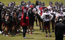 Atlanta Falcons head coach Arthur Smith, center, talks to the team during an NFL football rookie minicamp on Friday, May 14, 2021, in Flowery Branch, Ga. (AP Photo/Brynn Anderson)