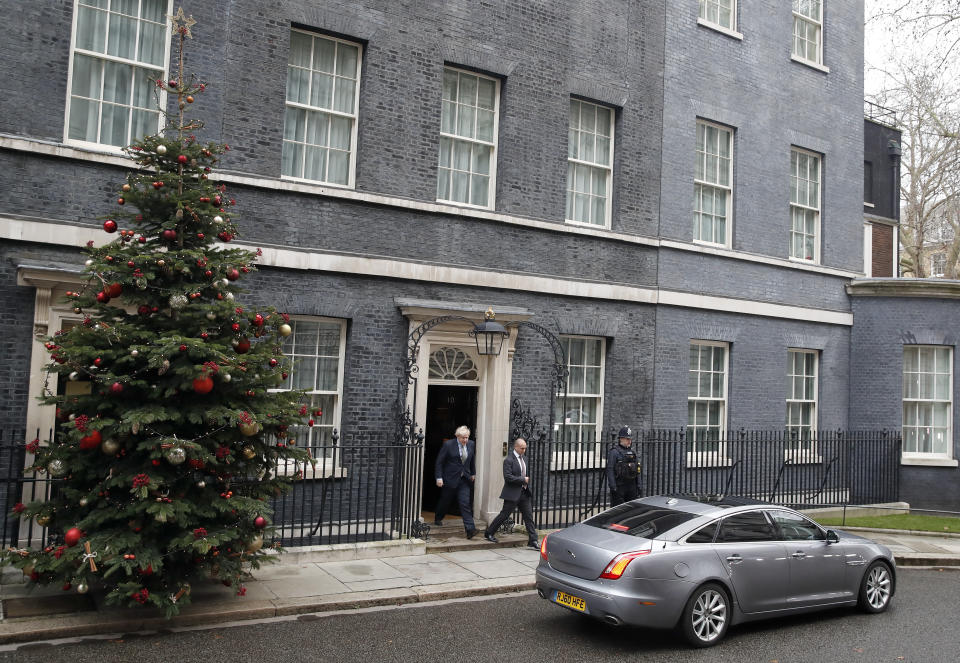 Britain's Prime Minister Boris Johnson leaves number 10 Downing Street in London, Friday, Dec. 13, 2019 on his way to meet Queen Elizabeth II to seek her approval to form a new government. Prime Minister Boris Johnson's Conservative Party has won a solid majority of seats in Britain's Parliament — a decisive outcome to a Brexit-dominated election that should allow Johnson to fulfill his plan to take the U.K. out of the European Union next month. (AP Photo/Thanassis Stavrakis)