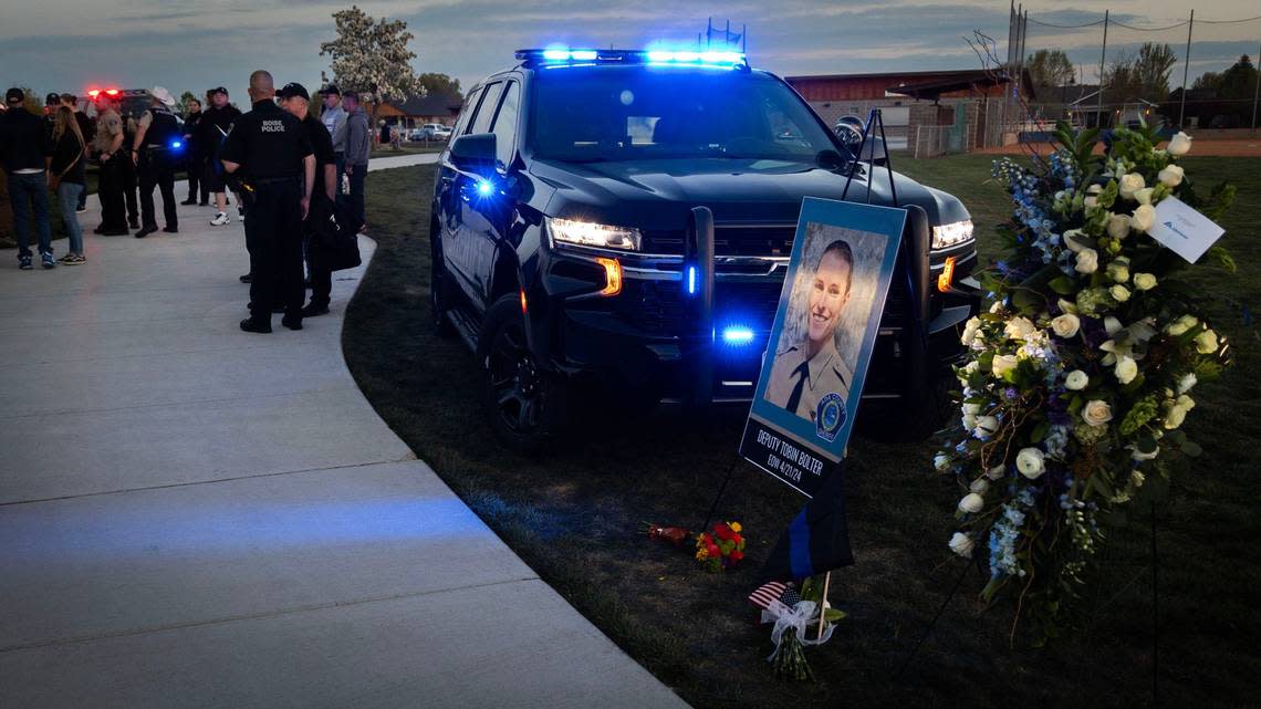 Hundreds of people gather for a vigil in honor of Ada County Sheriff’s Deputy Tobin Bolter, who was killed in the line of duty this past weekend. Members of the law enforcement community, friends and supporters met Tuesday at Hunter’s Creek Sports Park in Star.
