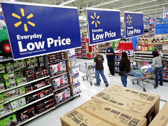 Residents shop at Walmart as the store prepares for Black Friday in Los Angeles, California in a November 24, 2014 file photo. REUTERS/Jonathan Alcorn/files