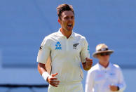 Cricket - Test Match - New Zealand v England - Eden Park, Auckland, New Zealand, March 22, 2018. New Zealand's Trent Boult celebrates with team mates after dismissing England's Alastair Cook during the first day of the first cricket test match. REUTERS/David Gray