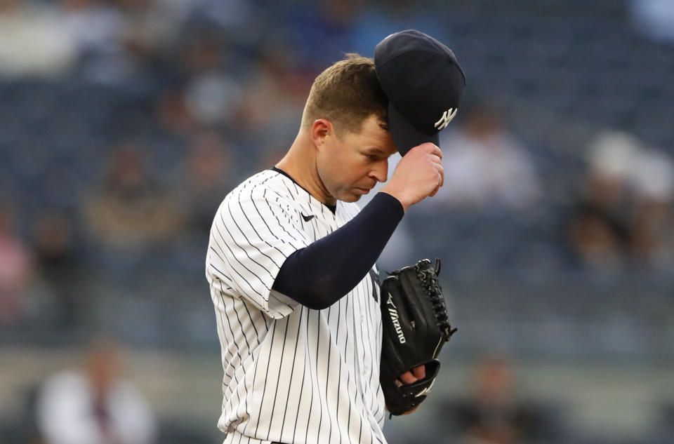 New York Yankees starting pitcher Corey Kluber (28) reacts after giving up a home run against the Toronto Blue Jays during the third inning of a baseball game Tuesday, May 25, 2021, in New York. (AP Photo/Noah K. Murray)