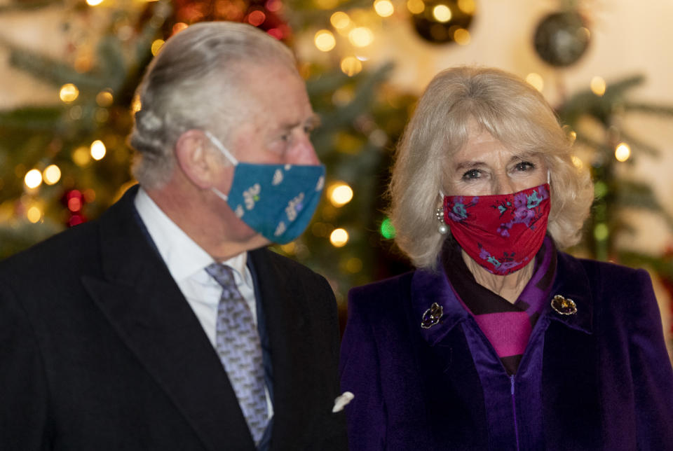 WINDSOR, ENGLAND - DECEMBER 08: Camilla, Duchess of Cornwall and Prince Charles, Prince of Wales during an event to thank local volunteers and key workers in the Quadrangle at Windsor Castle on December 8, 2020 in Windsor, England. (Photo by UK Press Pool/UK Press via Getty Images)