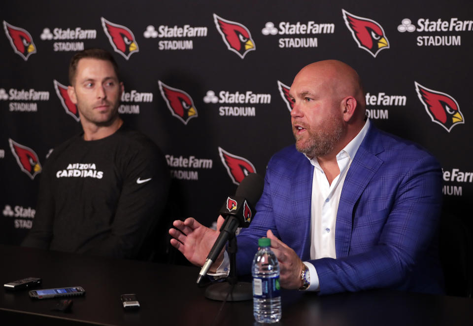 FILE - Arizona Cardinals head coach Kliff Kingsbury, left, and general manager Steve Keim discuss the upcoming NFL football draft during a news conference in Tempe, Ariz., in this Tuesday, April 16, 2019, file photo. They'll pick at No. 16 spot in the first round of the NFL Draft, April 29-May 1, 2021, and seem likely to target a defensive player, particularly a cornerback. (AP Photo/Matt York, File)