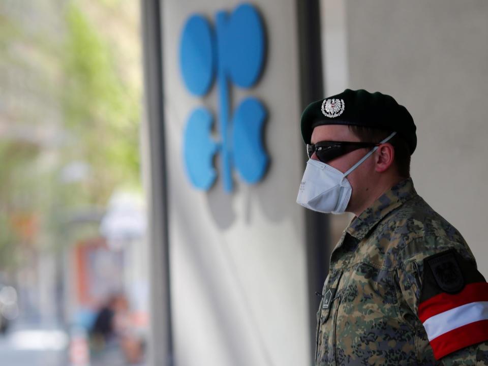 An Austrian army member stands next to the logo of the Organization of the Petroleoum Exporting Countries (OPEC) in front of OPEC's headquarters in Vienna: REUTERS