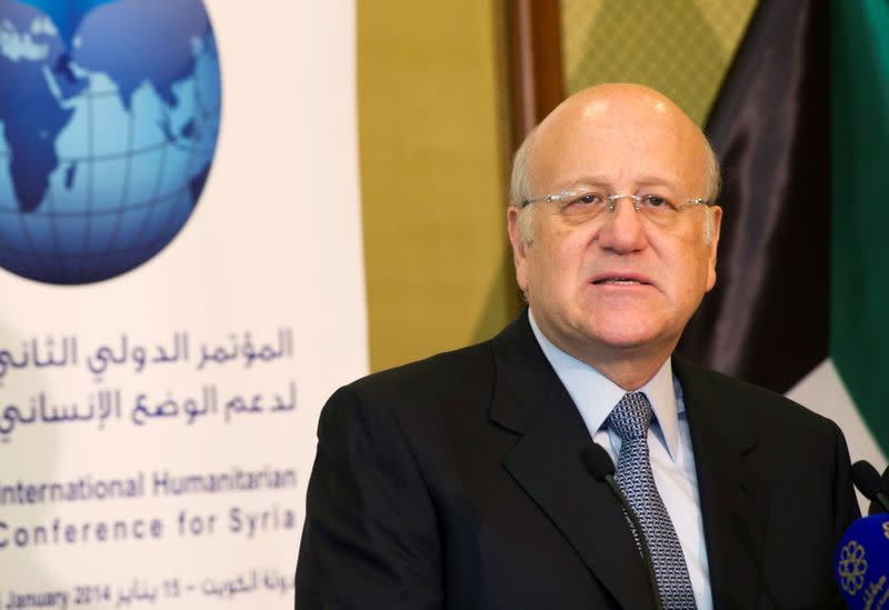 FILE PHOTO: Lebanon's caretaker Prime Minister Mikati attends a news conference at the opening session of the Syrian Donors Conference in Kuwait City