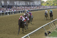 Jose Ortiz, left, atop Early Voting, wins the 147th running of the Preakness Stakes horse race at Pimlico Race Course, Saturday, May 21, 2022, in Baltimore. (AP Photo/Julio Cortez)