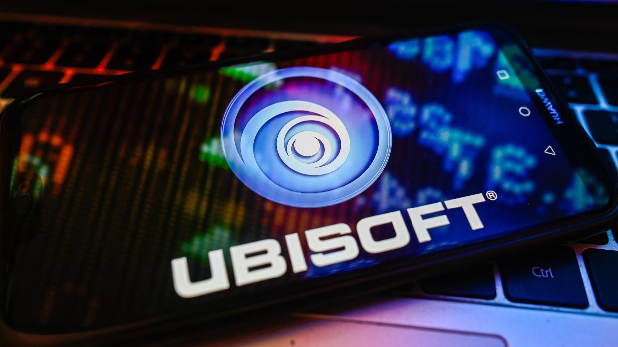  POLAND - 2023/11/09: In this photo illustration a UbiSoft logo is displayed on a smartphone with stock market percentages on a laptop. (Photo Illustration by Omar Marques/SOPA Images/LightRocket via Getty Images). 