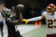 Atlanta Falcons wide receiver Calvin Ridley (18) makes the catch against Washington Football Team cornerback William Jackson (23) during the second half of an NFL football game, Sunday, Oct. 3, 2021, in Atlanta. Jackson was called on a penalty on the play. (AP Photo/John Bazemore)