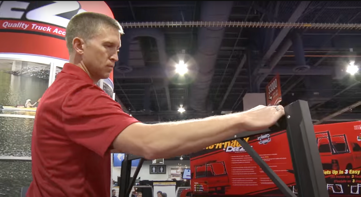 Inventor and Shark Tank participant Donny McCall looks over the Invis-A-Rack, his invention being manufactured at Dee Zee, Inc., in Des Moines.