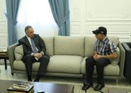 Iraqi Prime Minister Mustafa al-Kadhimi meets with Iraqi teenager Hamid Saeed, who was mistreated by members of security forces, after he was released from jail in Baghdad