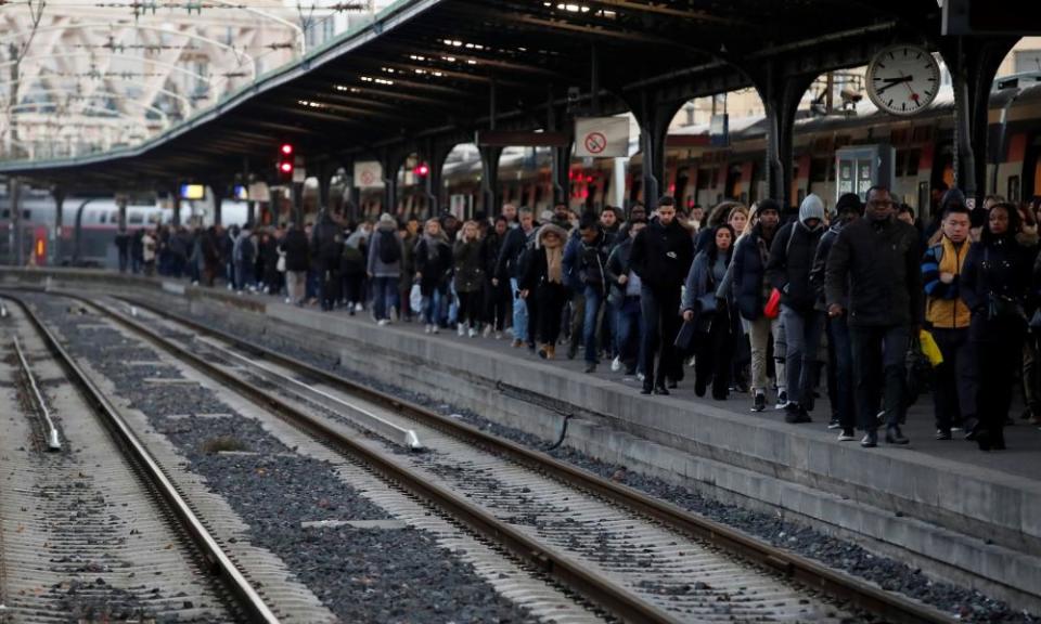 Commuters wait at Gare de l’Est train station in Paris