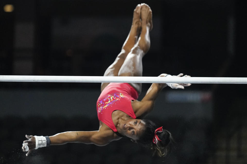 Simone Biles, a seven-time Olympic medalist and the 2016 Olympic champion, practices on the uneven bars at the U.S. Classic gymnastics competition Friday, Aug. 4, 2023, in Hoffman Estates, Ill. (AP Photo/Erin Hooley)