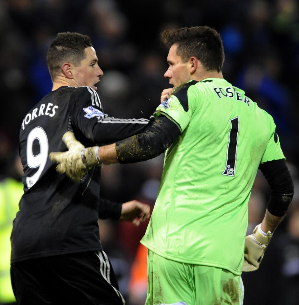 West Brom's goalkeeper Ben Foster right, reacts with Chelsea's Fernando Torres after the English Premier League soccer match between West Bromwich Albion and Chelsea at The Hawthorns Stadium in West Bromwich, England, Tuesday, Feb. 11, 2014. (AP Photo/Rui Vieira)