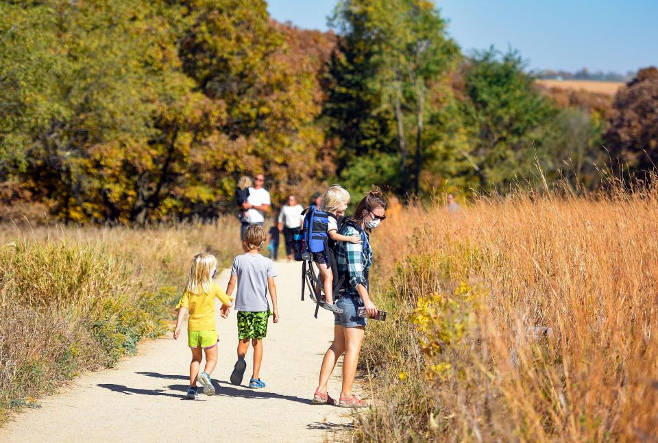 Families take a walk through Good Earth State Park in Sioux Falls.