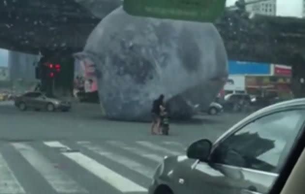 The balloon was seen bouncing through busy streets, towards pedestrians. Image: China Xinhua News