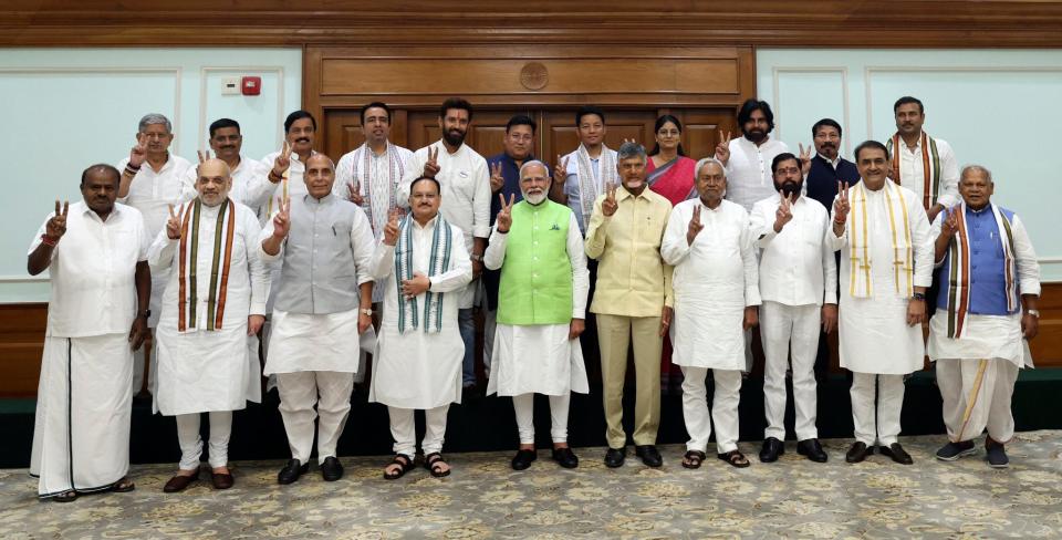 Narendra Modi, center, poses for a photograph with senior leaders of the Bharatiya Janata Party (BJP) and to his left, Telugu Desam Party leader N Chandrababu Naidu, and Janata Dal (United) leader Nitish Kumar, during a meeting at his residence in New Delhi, India, Wednesday, 5 June 2024 (AP)