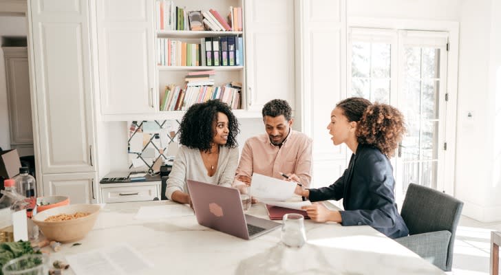 A couple getting investment advice with an advisor