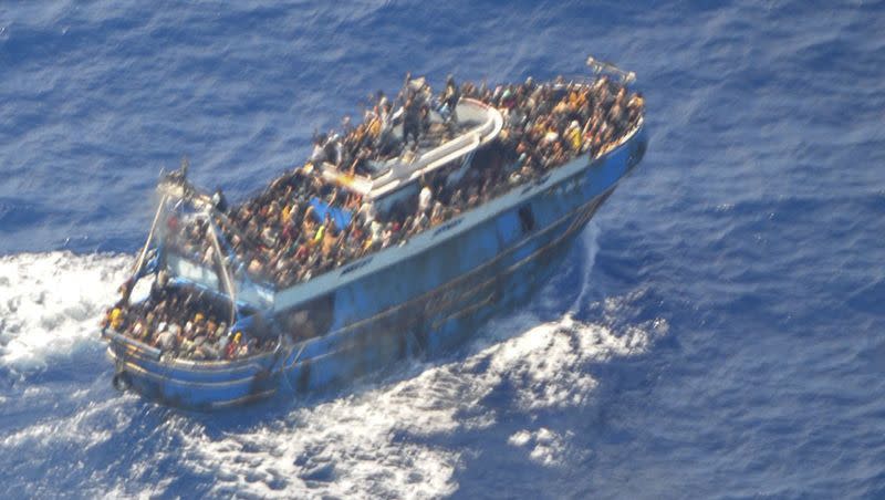 This undated handout image provided by Greece’s coast guard on Wednesday, June 14, 2023, shows scores of people on a battered fishing boat that later capsized and sank off southern Greece. Human rights advocates believe the missing Titan submersible received more attention than the Greek shipwreck.