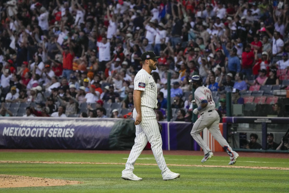 Colorado Rockies pitcher Tyler Kinley reacts as Houston Astros Yordan Alvarez runs the bases after hitting a solo home run during the ninth inning of a baseball game at Alfredo Harp Helu stadium in Mexico City, Saturday, April 27, 2024. (AP Photo/Fernando Llano)