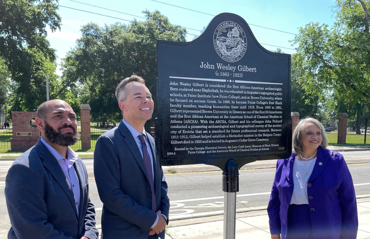 Standing by the new John Wesley Gilbert marker on Paine College's campus are Corey Rogers (from left), executive director of Augusta's Lucy Craft Laney Museum of Black History; Dr. John W. I. Lee, author of the 2021 book "The First Black Archaeologist: A Life of John Wesley Gilbert" and associate professor of ancient history at University of California Santa Barbara; and Paine President Dr. Cheryl Evans Jones, on May 2, 2024.