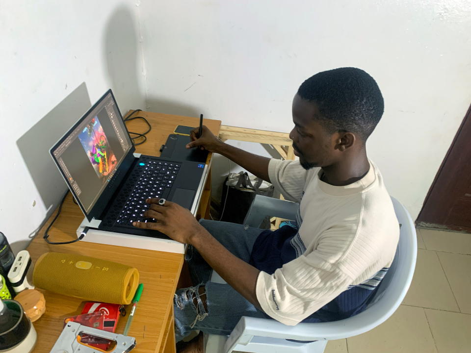 Digital artist Abdulrahman Yusuf works on an artwork at his home studio in Lagos, Nigeria, November 4, 2021. Picture taken November 4, 2021. REUTERS/Nneka Chile