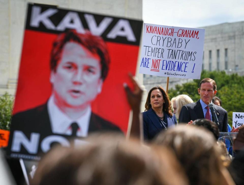 Then-Sen. Kamala Harris and Sen. Richard Blumenthal, D-Conn., speak to protesters gathered at the U.S. Supreme Court in 2018, ahead of a Senate Judiciary Committee vote on Brett Kavanaugh’s nomination to the court. Harris questioned Kavanaugh relentlessly during the hearings. 