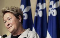 Parti Quebecois leader Pauline Marois speaks to the press at the City Hall in Montreal, Quebec, March 16, 2014. Quebec voters will go to the polls in a provincial election on April 7. REUTERS/Christinne Muschi (CANADA - Tags: POLITICS)