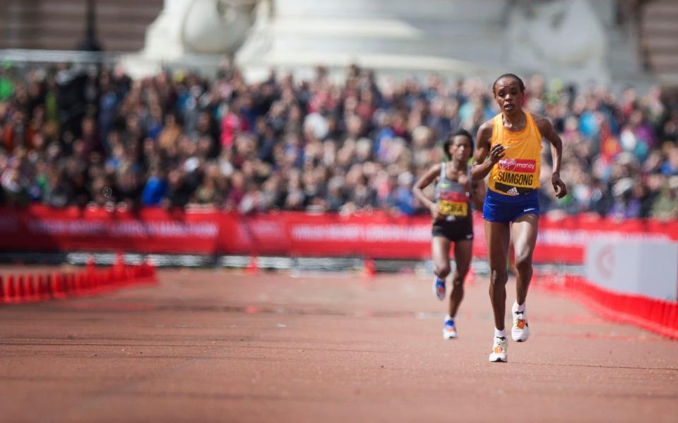 Daily Telegraph warren allott for the Telegraph The WINNER OF THE WOMANS ELITE RACE SUMgONG runs along the Mall towards the FINISH LINE in the London Marathon ON April 24, 2016 in London, England - Credit: Warren Allott/Telegraph