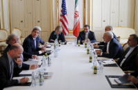 U.S. Secretary of State John Kerry (centre L) meets Iranian Foreign Minister Mohammad Javad Zarif (2nd R) at a hotel in Vienna, Austria July 1, 2015. REUTERS/Carlos Barria
