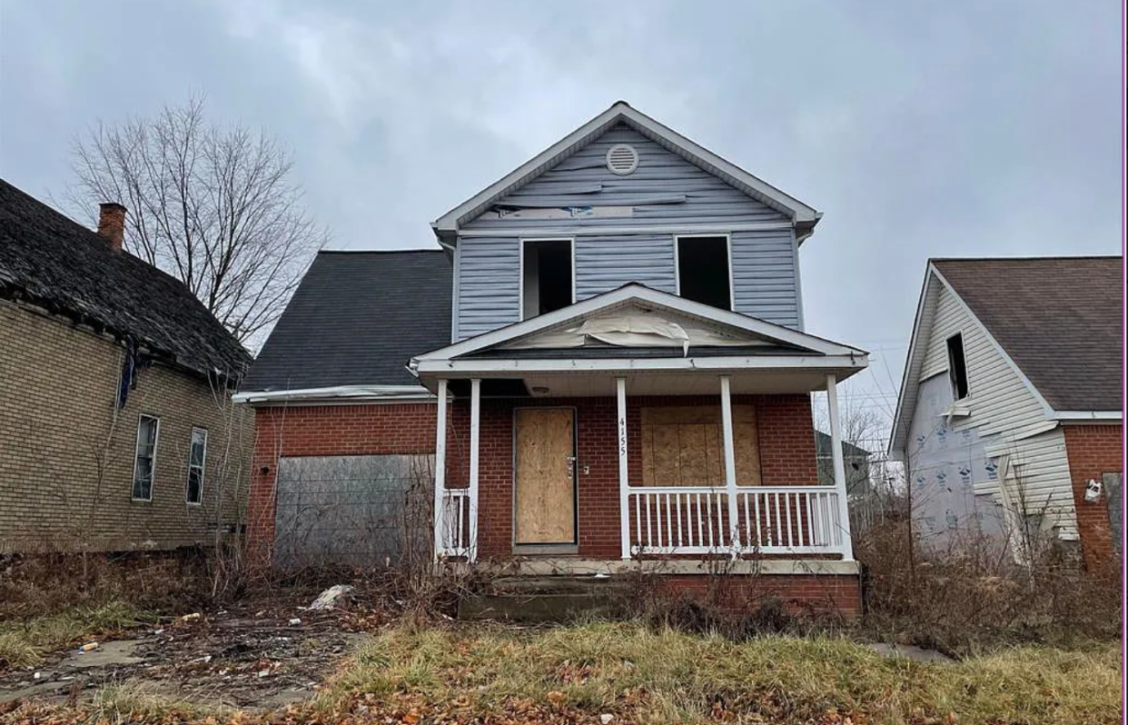 shuttered foreclosed house