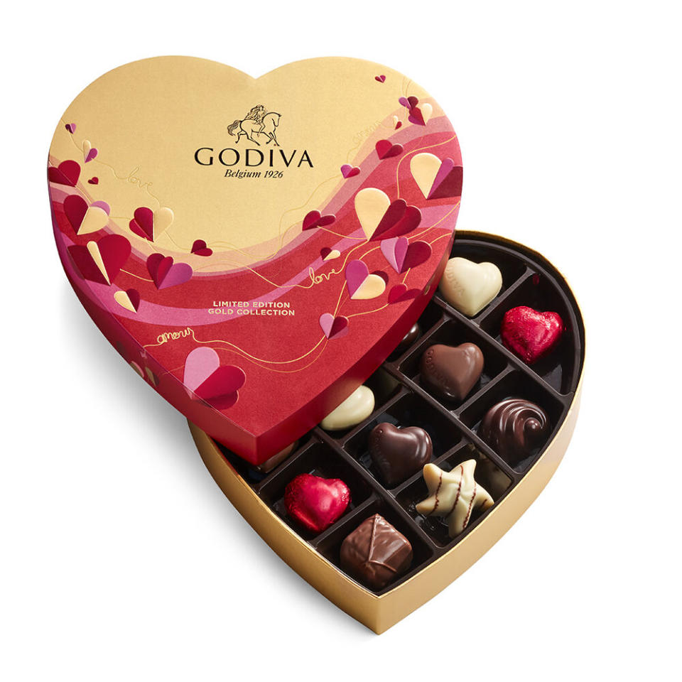 gold and red heart-shaped godiva chocolate box