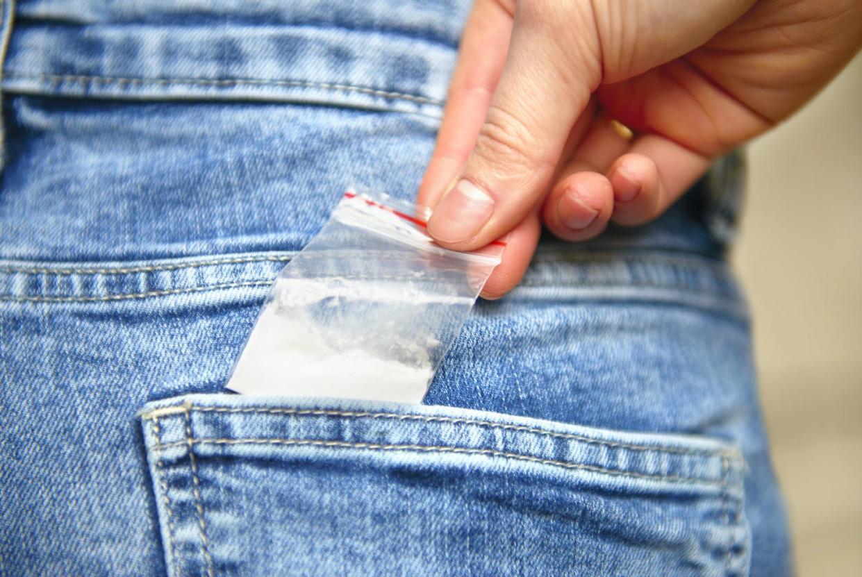 <span class="caption">According to Oregon law, possessing a small amount of drugs for personal consumption is now a civil – rather than criminal – offense. </span> <span class="attribution"><a class="link " href="https://www.gettyimages.com/detail/photo/teenage-schoolgirl-reaching-for-cocaine-in-her-back-royalty-free-image/1132980785?adppopup=true" rel="nofollow noopener" target="_blank" data-ylk="slk:Peter Dazeley via Getty;elm:context_link;itc:0;sec:content-canvas">Peter Dazeley via Getty</a></span>