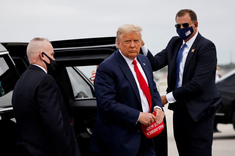 FILE PHOTO: U.S. President Donald Trump arrives to board the Air Force One as he departs for campaign travel at Miami International Airport in Miami, Florida