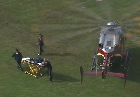 Rescue workers unload a stretcher from a helicopter following a shooting incident at the municipal center in this still image from video in Virginia Beach